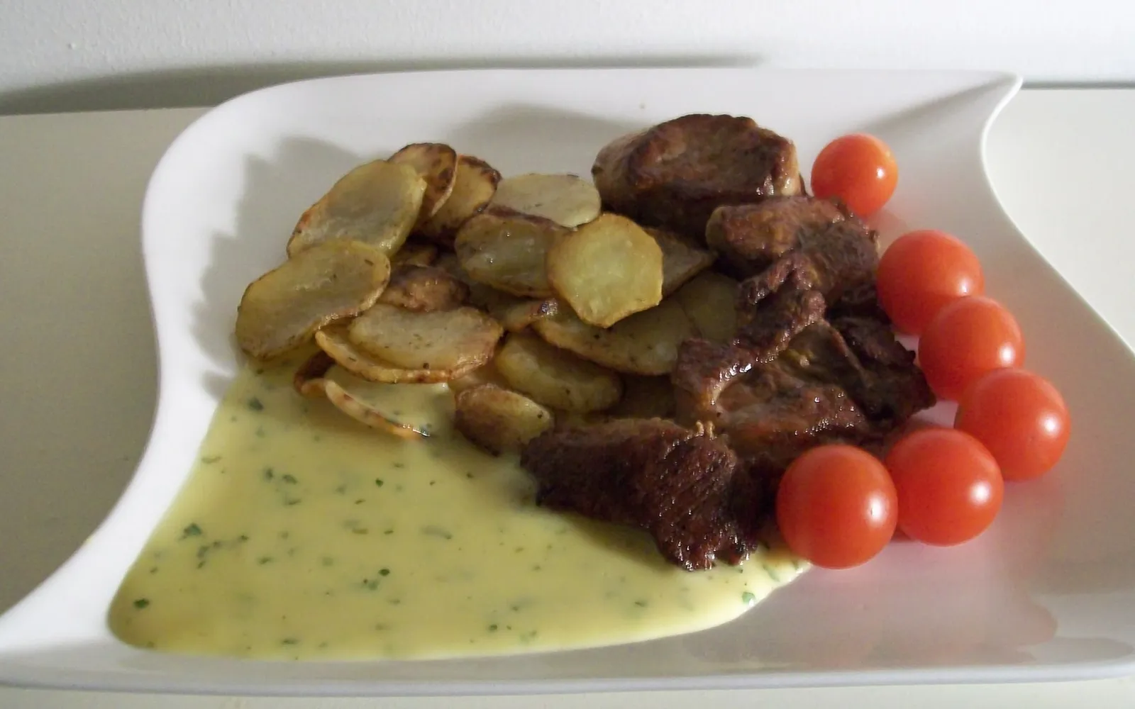 Fläskfilé och råstekt potatis
